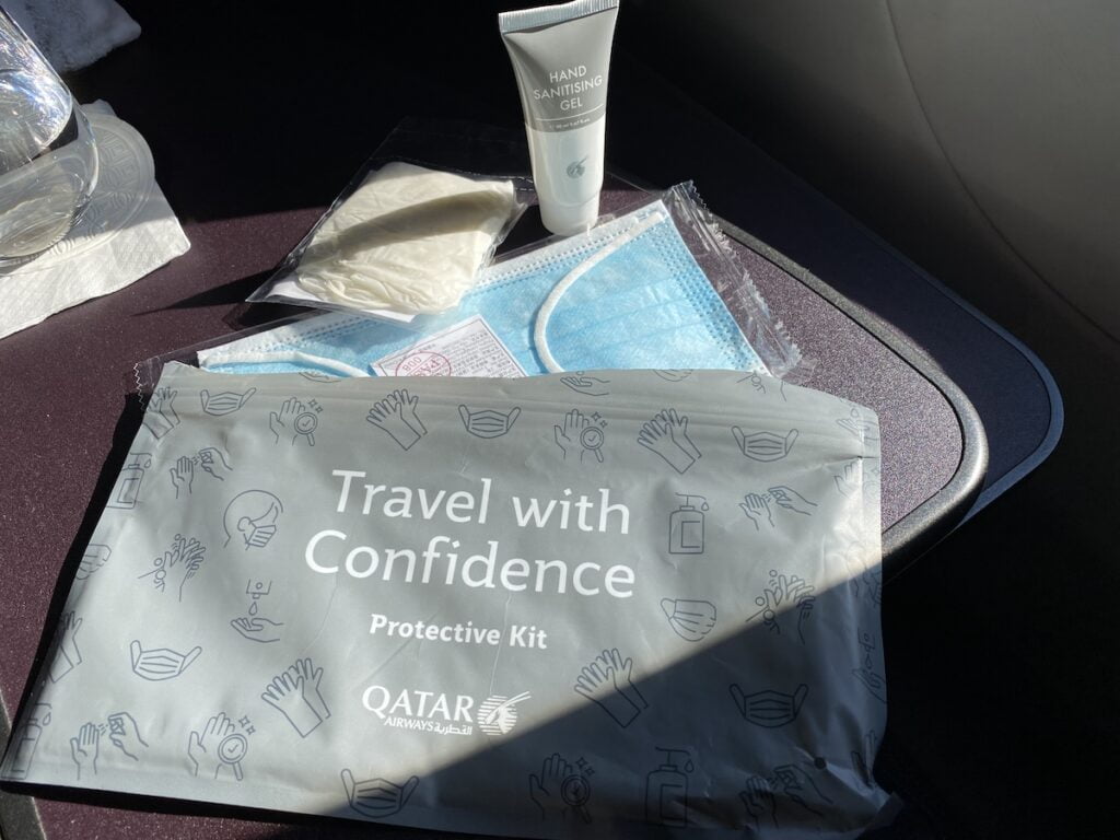 Qatar QSuite safety kit with mask, gloves, and hand sanitizer