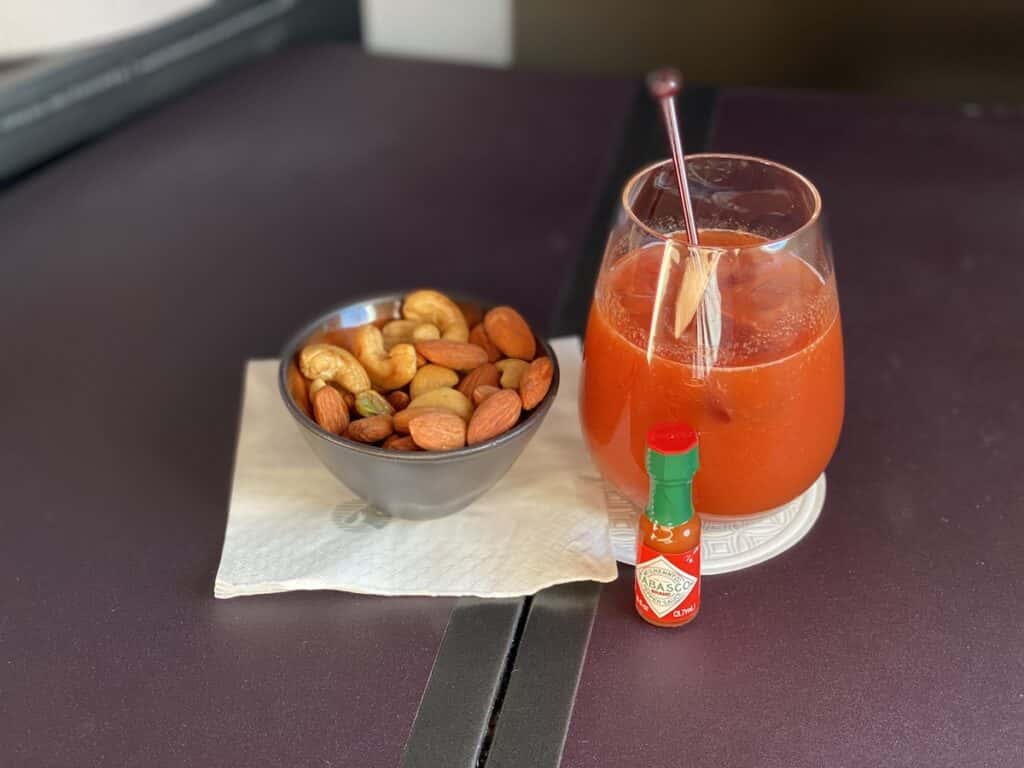 Spicy tomato juice and warm nuts