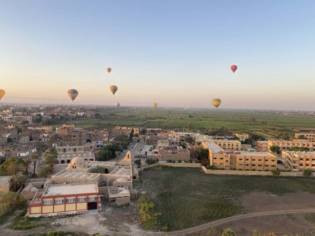 hot air balloon flying over Luxor Egypt