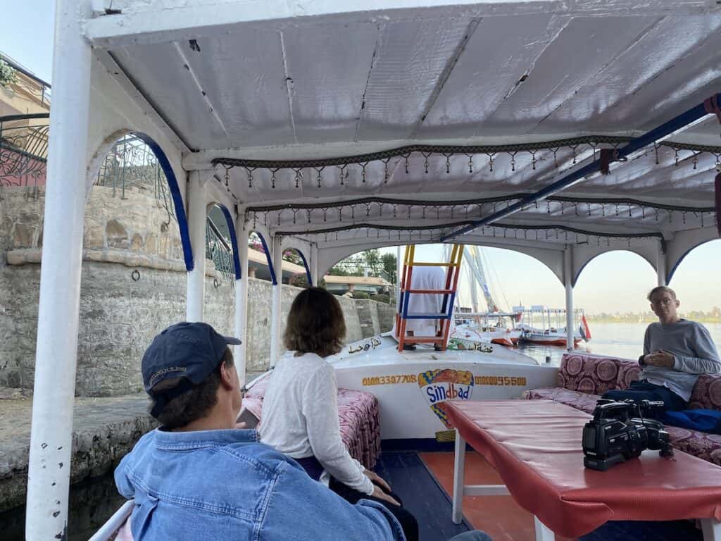 people on boat heading to the hotel