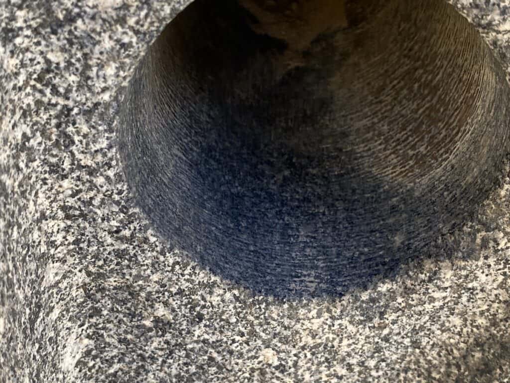 Tube drill hole in black granite