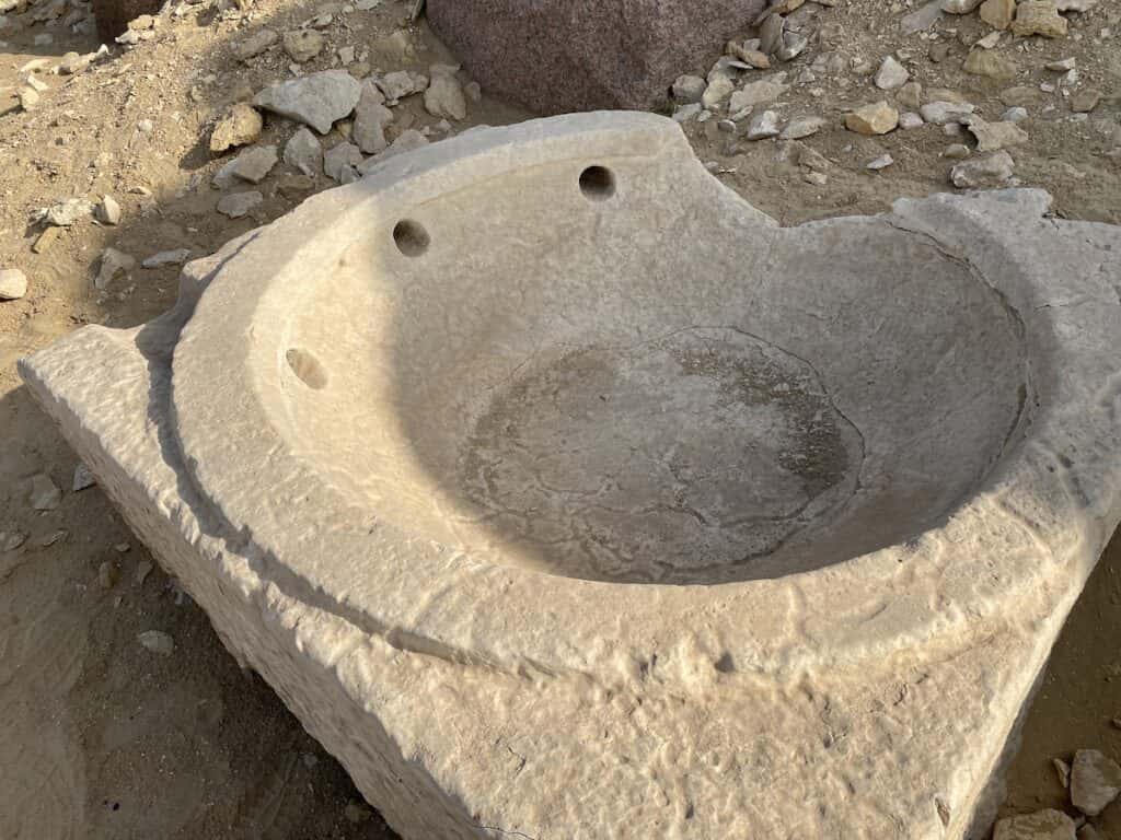 Stone bowl at Abu Ghorab with three holes