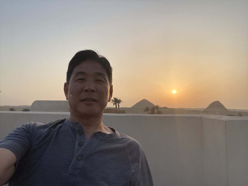man with sunset in background