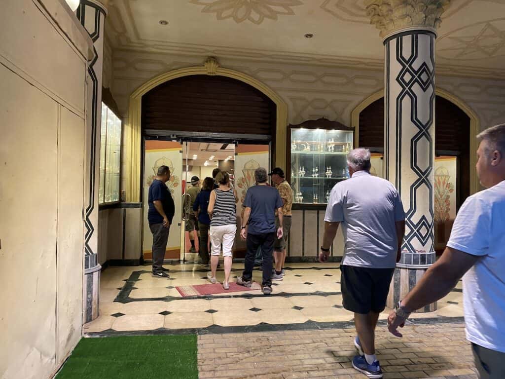 people entering a perfume shop