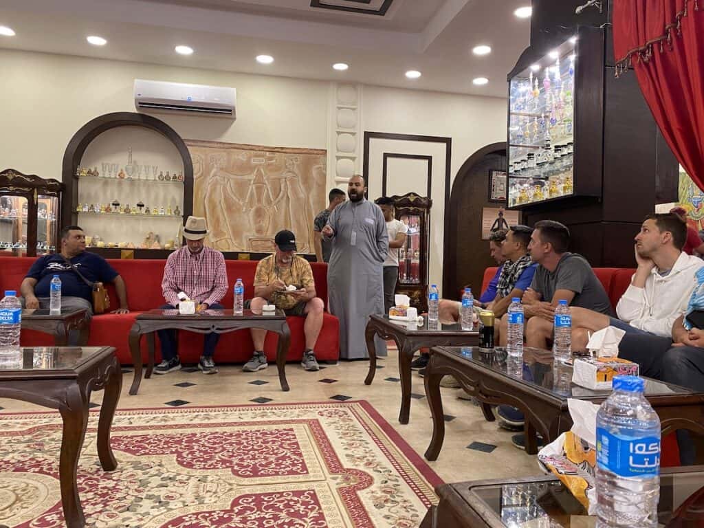 perfume store owner selling perfume