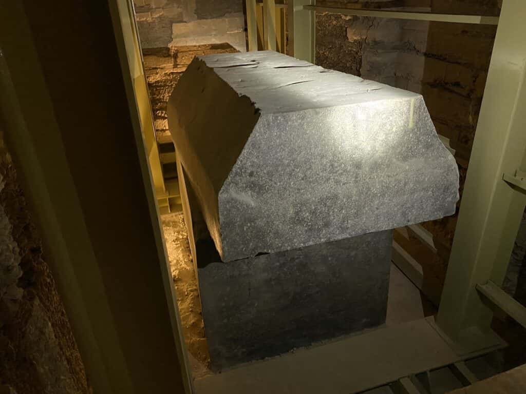 Stone box with lid askew in the Serapeum.