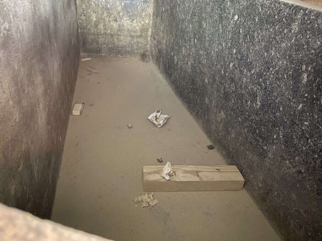 Trash thrown inside a box in the Serapeum