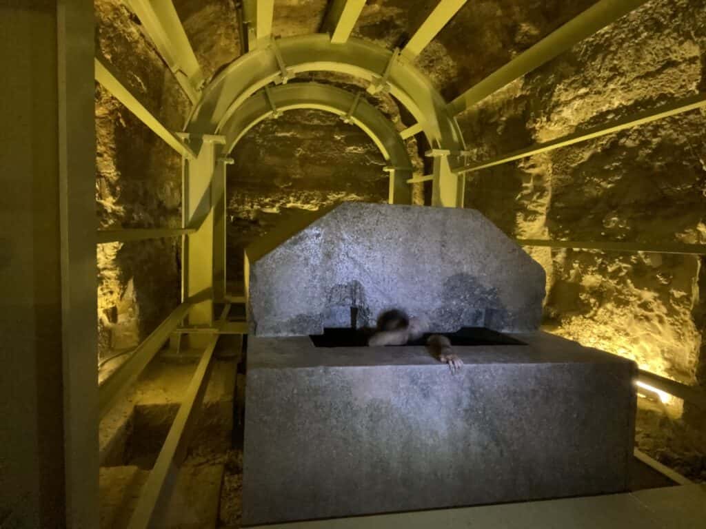 Man falling inside a massive box in the Serapeum