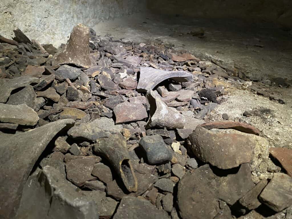 Human bones and pottery shards in the Osiris Shaft