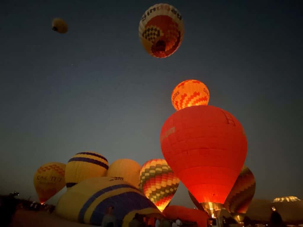 hot air balloons rising into the sky