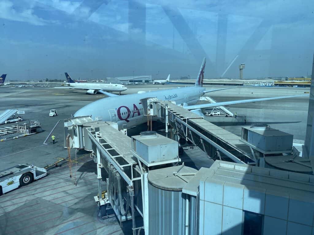 Qatar Airways jet parked at the gate