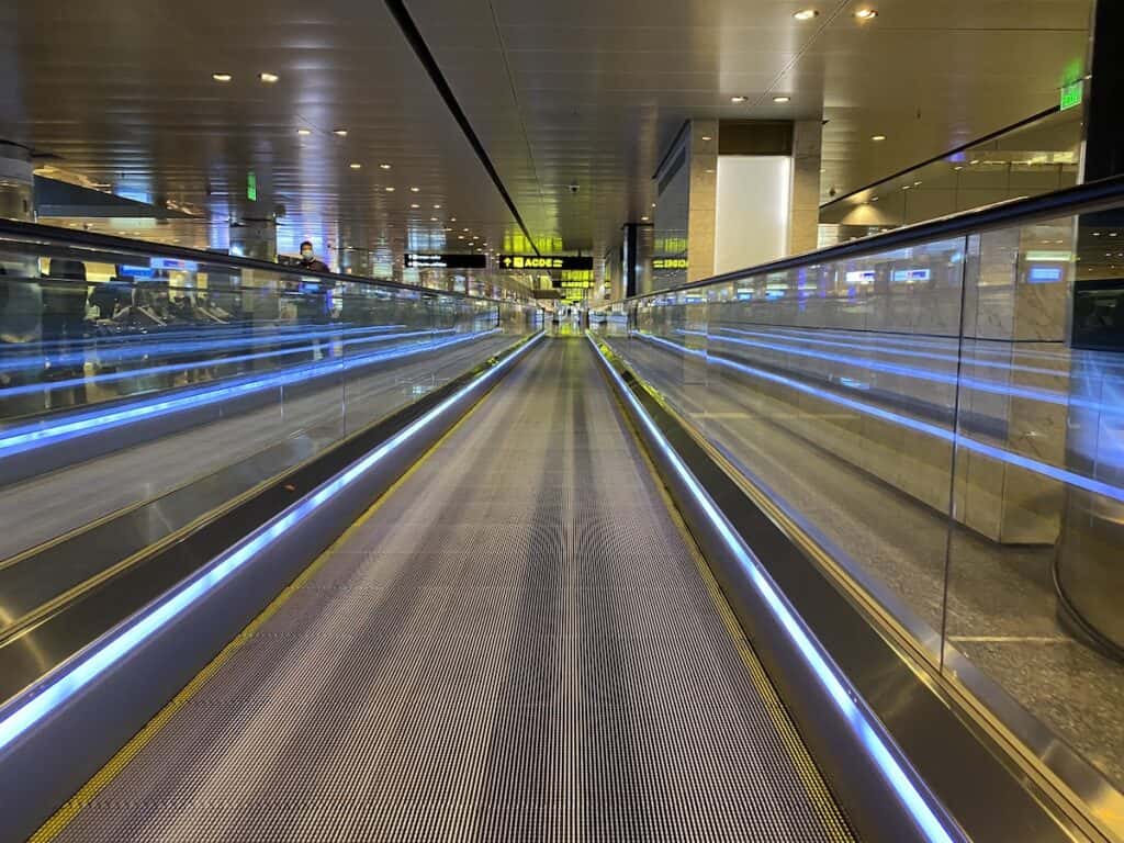 Long moving walkway in the Doha airport gate area