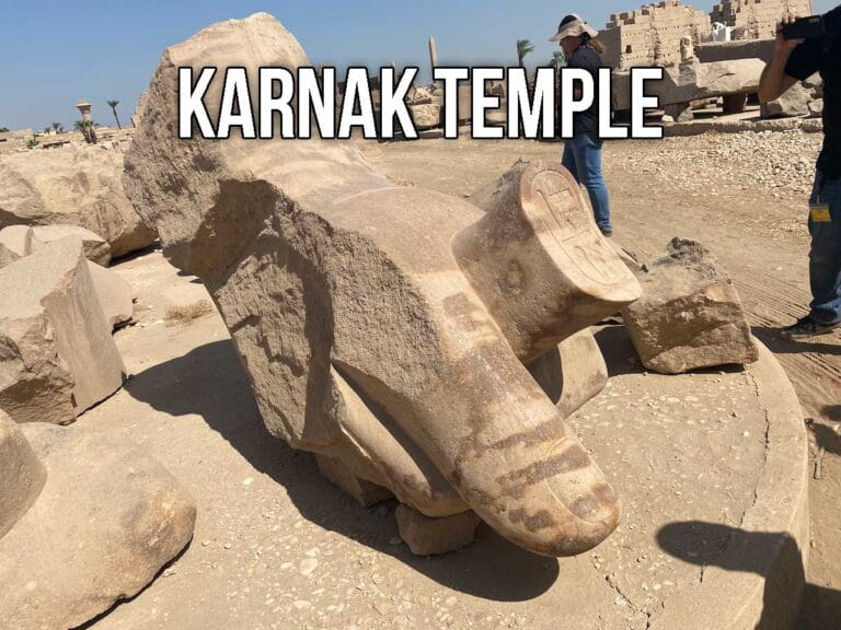 Large sculpted carving of a hand.