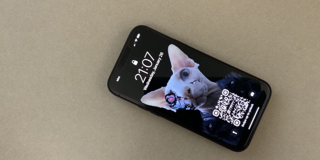 Photo of a locked cell phone with a digital business card QR code