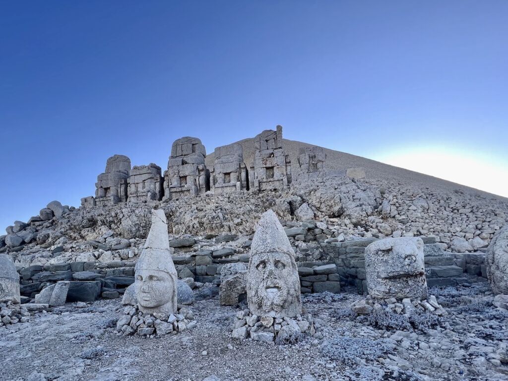 Statue of seated bodies, with heads in front. Includes AntiochusAntiochus I Theos, the King, and gods.