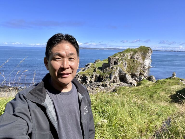 Man at Kinbane Head on the Antrim Coast of Northern Ireland.