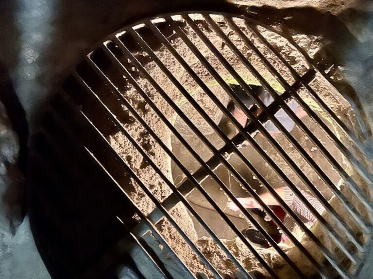 Hole in the floor above a passageway