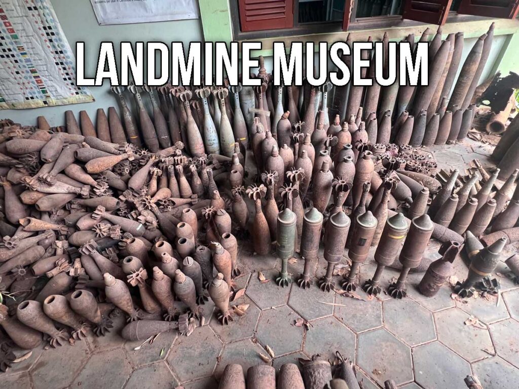 Rows of rusted deactivated bombs and mortar shells stacked on the floor of the Cambodia Landmine Museum, part of an exhibit showing the country’s war-torn past.