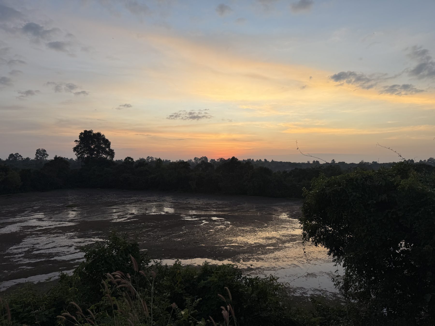 Sunset over the moat seen from the southwest corner of the Angkor Thom wall