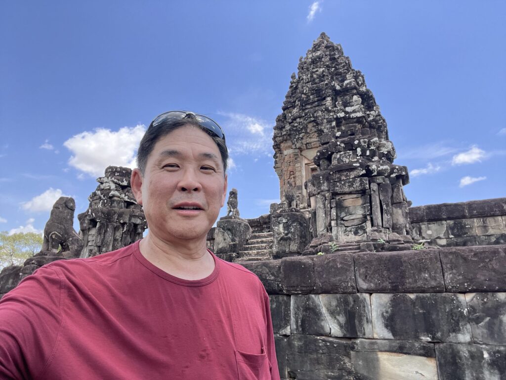 The author on the top level of Bakong temple in April with the central tower behind