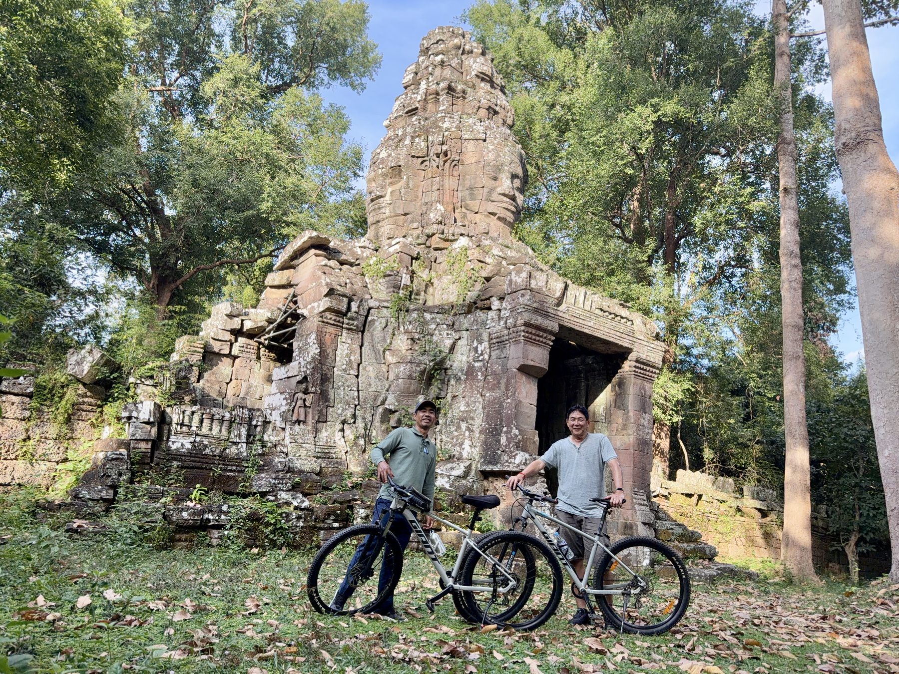 The author and Cambodia Backroads guide Kanha Phum with mountain bikes at the Banteay Kdei south gate