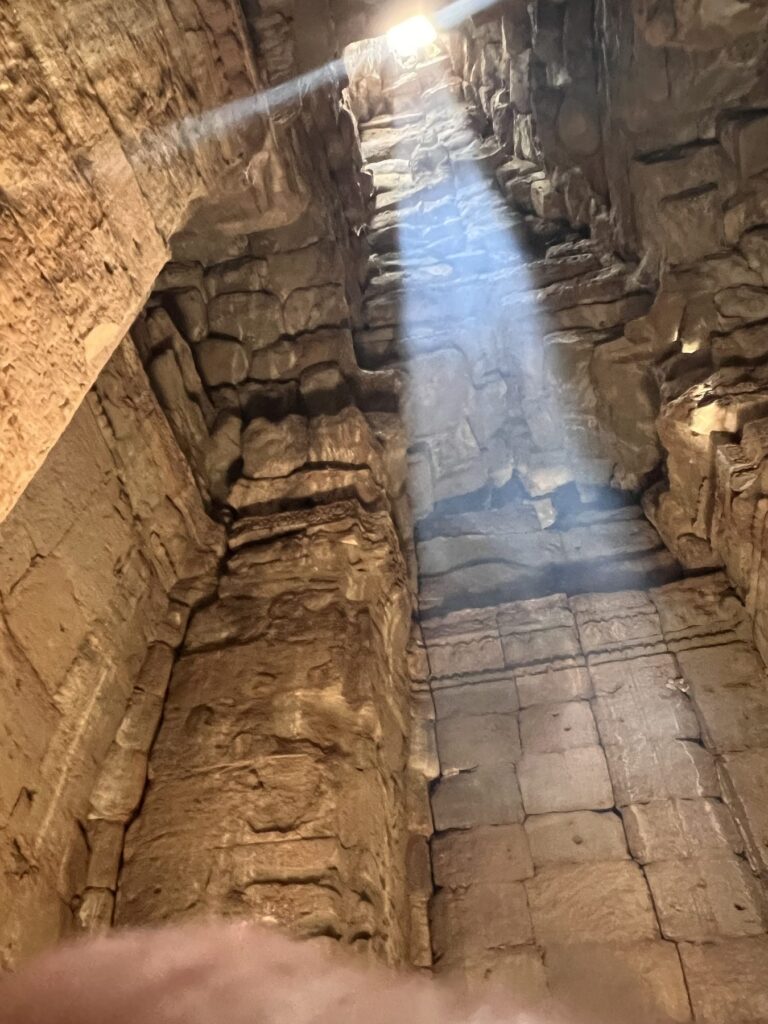 The zenith sunbeam shining down into a narrow chamber at the Bayon in April
