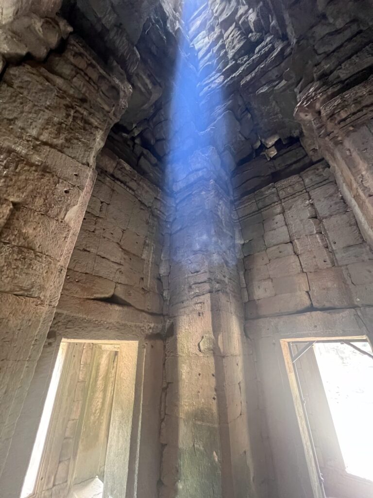 The zenith beam dropping down the center of a Bayon tower chamber in August