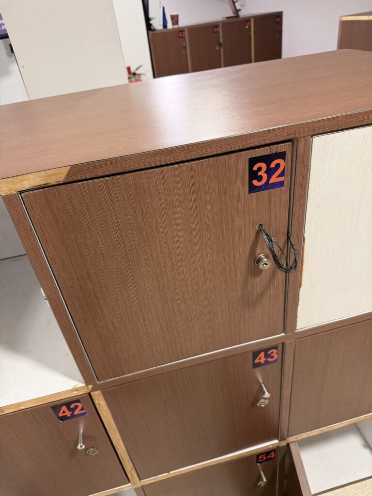 Numbered wooden lockers for bags at the Borobudur sunrise check-in