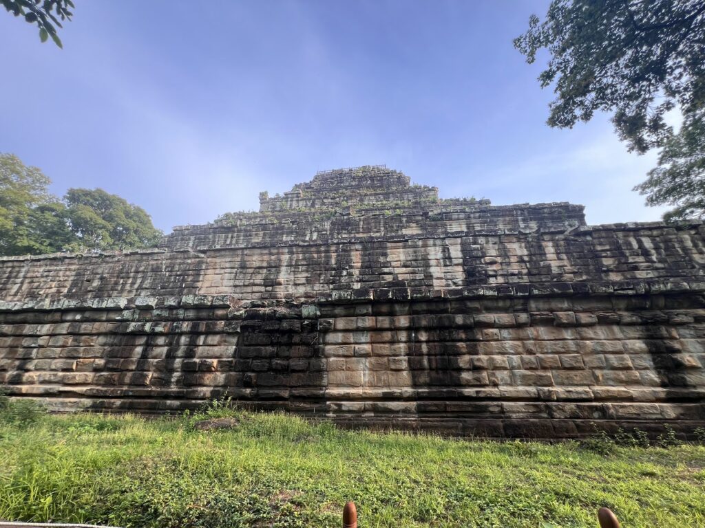 The stepped sandstone tiers of the Koh Ker pyramid against a blue sky