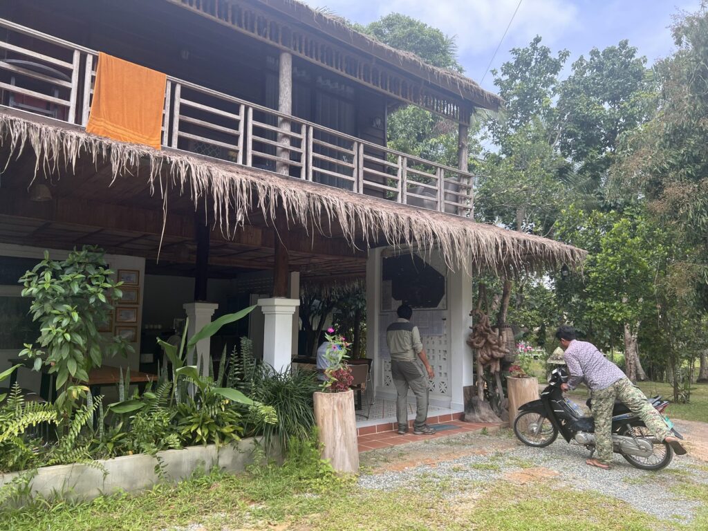 The moto tour base camp house with a thatched roof in Anlong Thom on Phnom Kulen