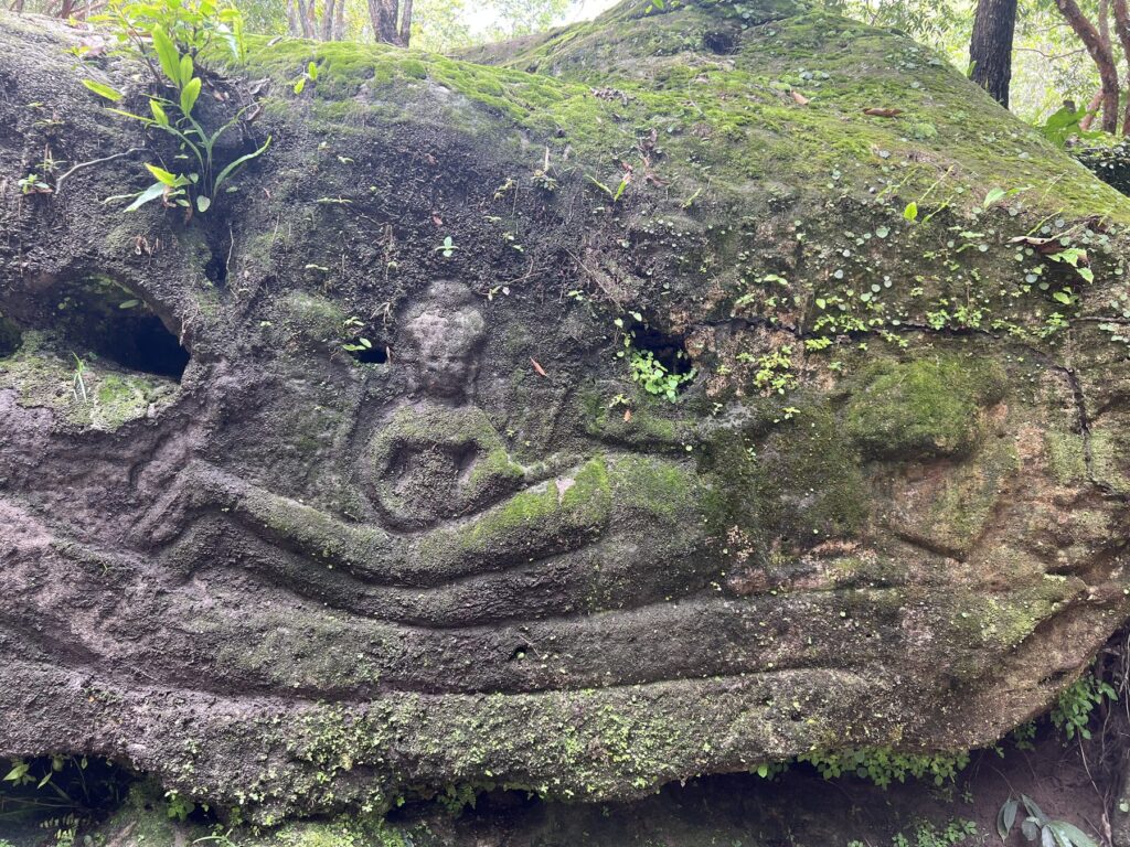 A carving of reclining Vishnu on a rock at Peung Tbal on Phnom Kulen