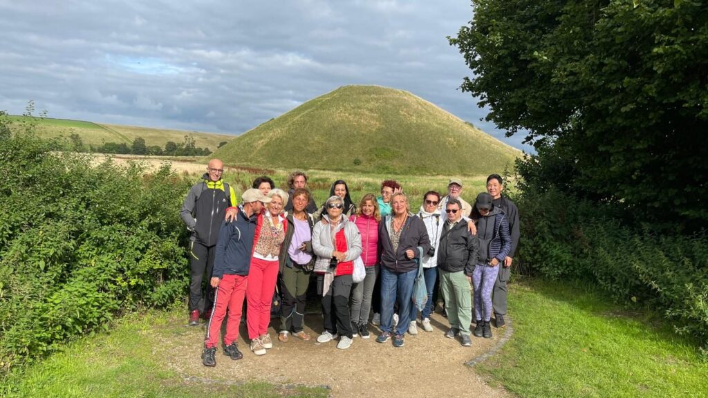 The 2023 England tour group in front of Silbury Hill