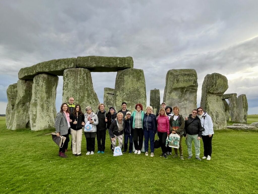 The 2023 Megalithomania and Ancient Spirit Tours group inside the Stonehenge circle
